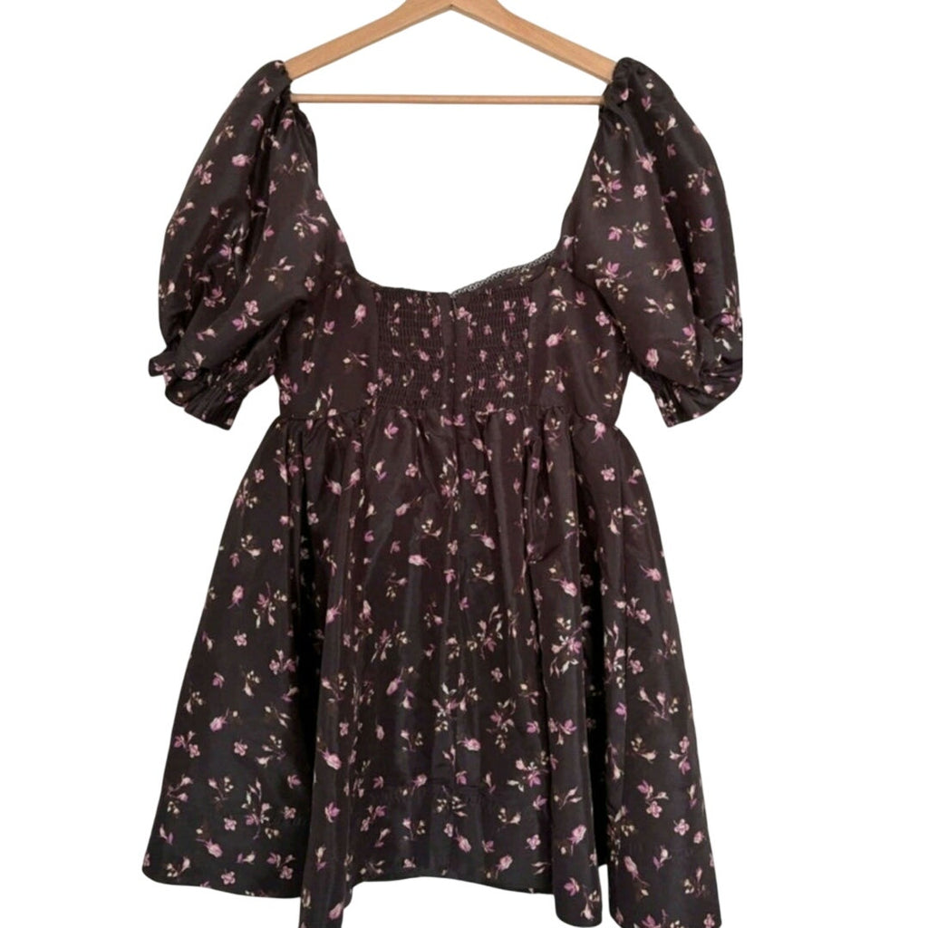 Floral mini dress front on hanger with gathered waist and puff sleeves