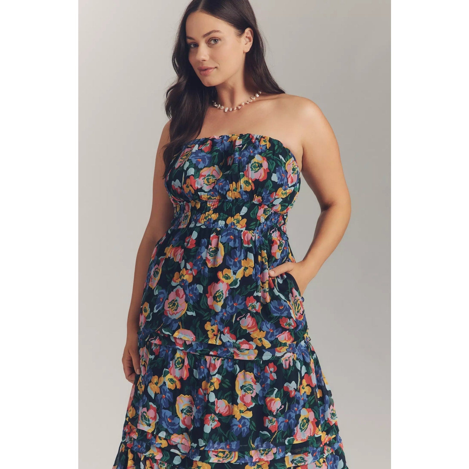 Strapless tiered maxi dress with colorful floral print, smocked top and layered skirt
