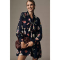 Navy floral long-sleeve mini dress with tie-neck and gathered front