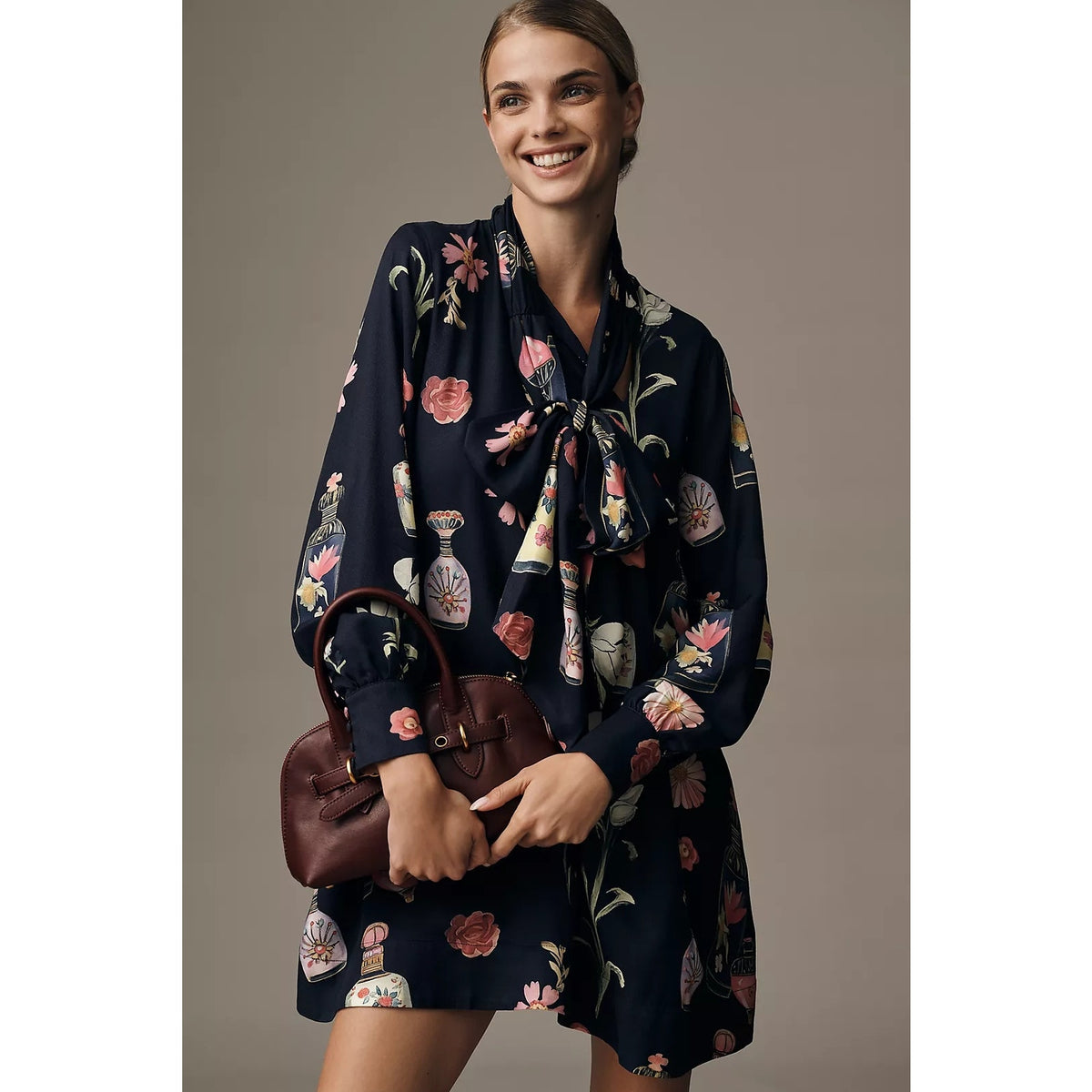 Navy floral long-sleeve mini dress with tie-neck and gathered front