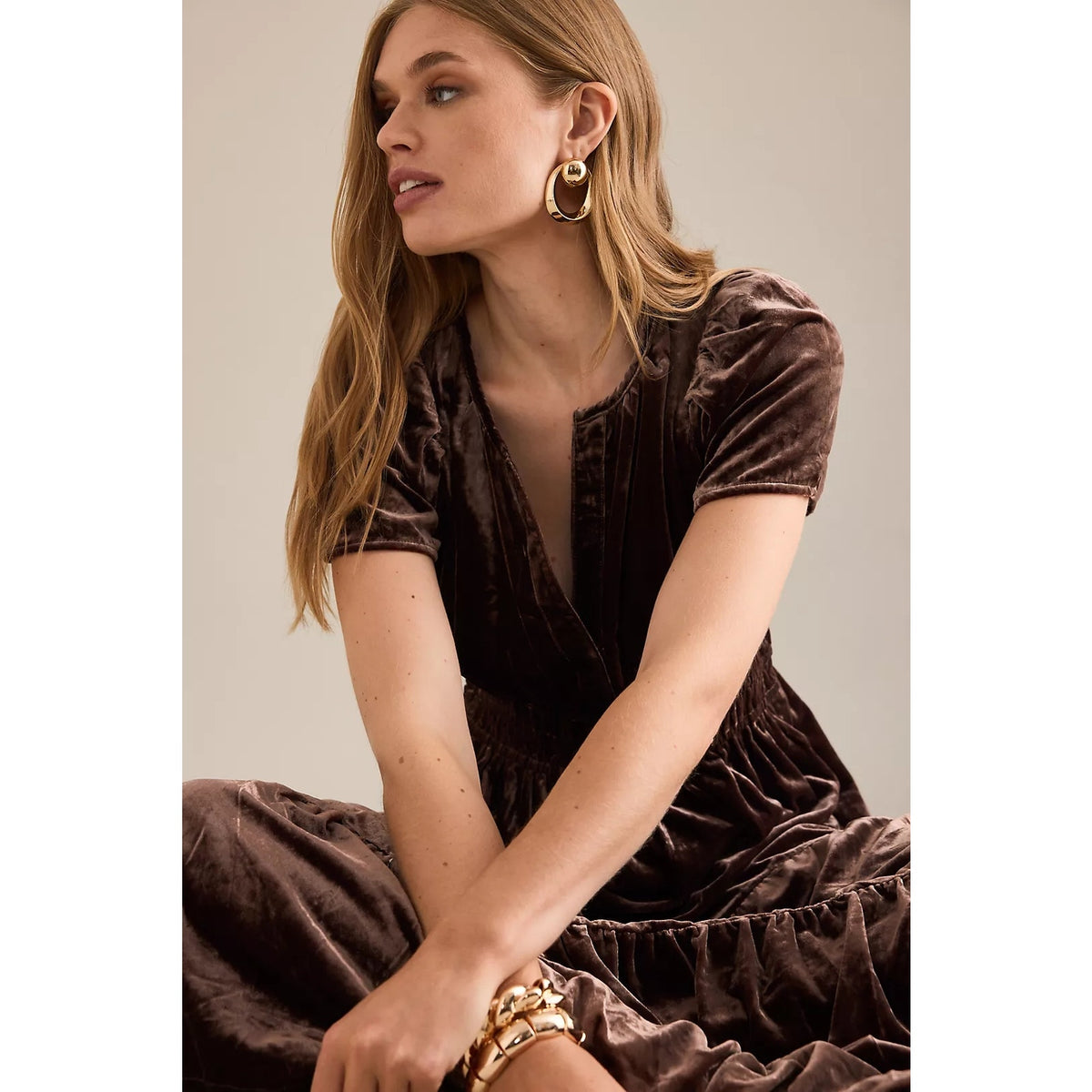 Chocolate velvet maxi dress close-up: V-neck, short sleeves, smocked waist detail