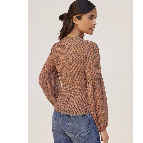 Brown printed wrap blouse with long puff sleeves and tie waist, back view