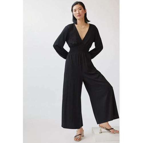Black V-neck wide-leg jumpsuit with gathered waist and flared legs
